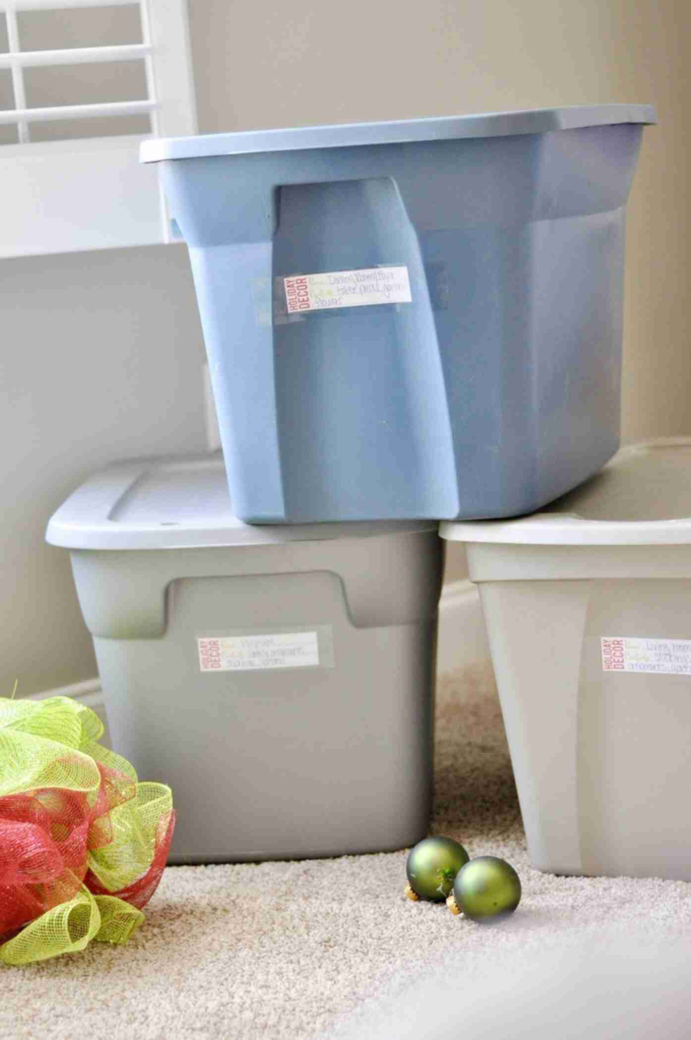 Check out how to organize Christmas storage bins and grab a free printable for your holiday storage boxes! Lots of organization tips and tricks on ways to store Christmas decorations.