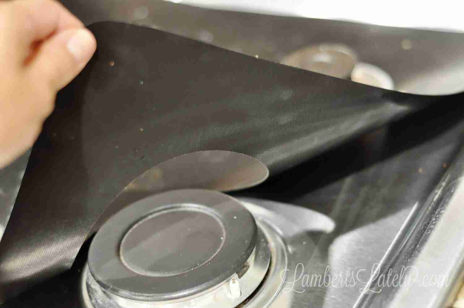 This post shows how to make a DIY Stove Splatter Guard - perfect for keeping kitchens/gas stovetops clean! This guard covers a gas stove to protect stainless steel from spills and stains.